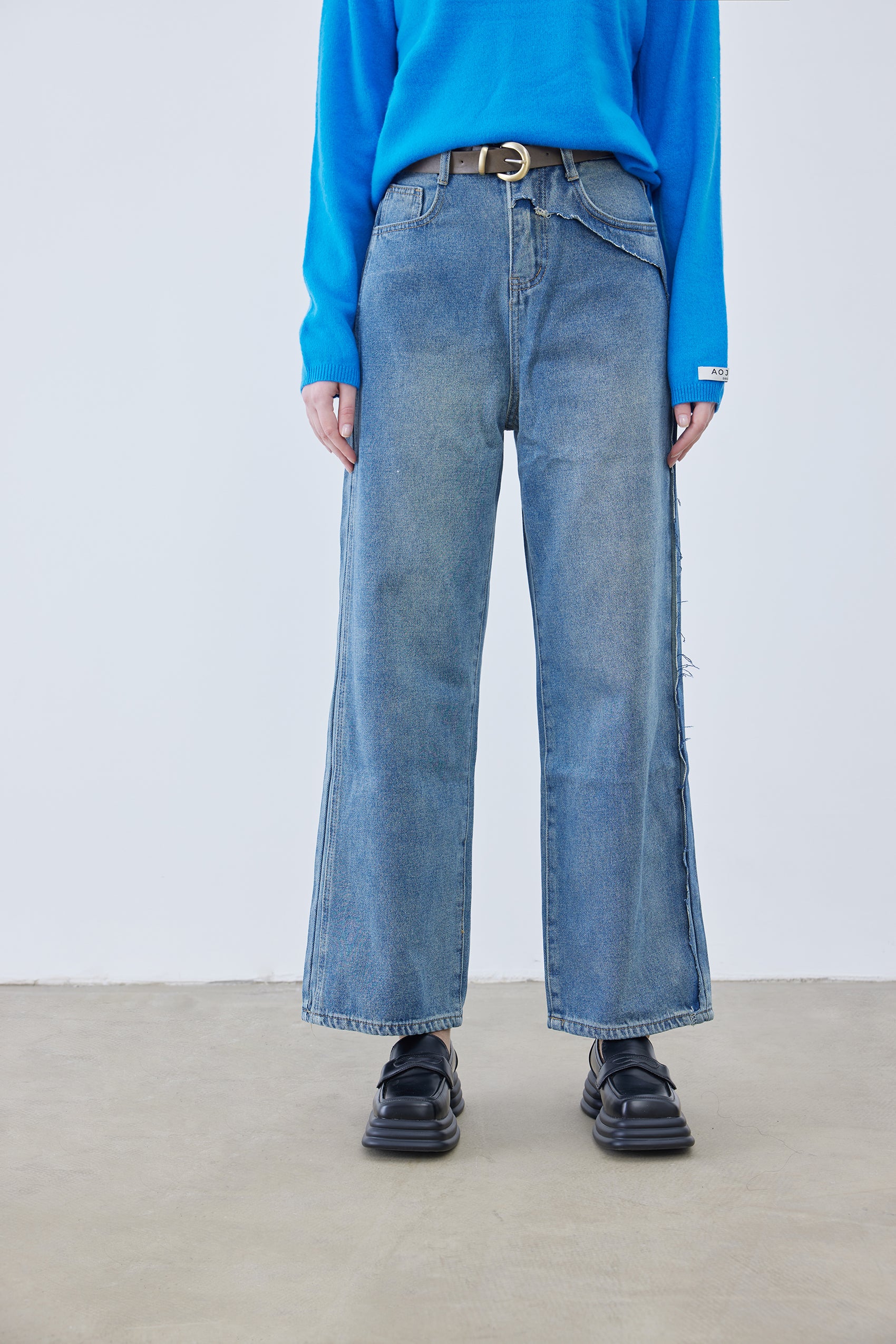 Asymmetrical distressed jeans