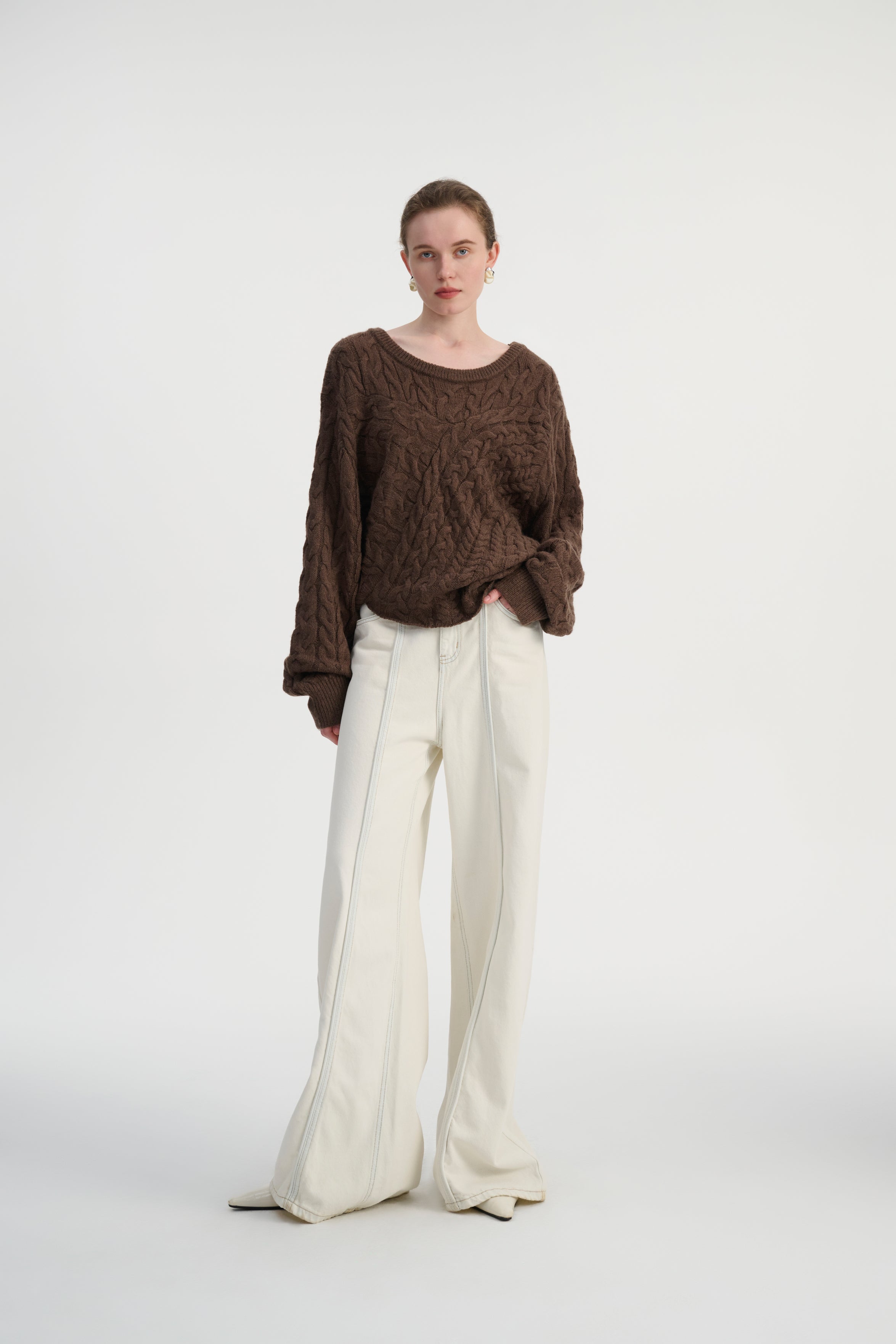 Asymmetrical cable knit sweater