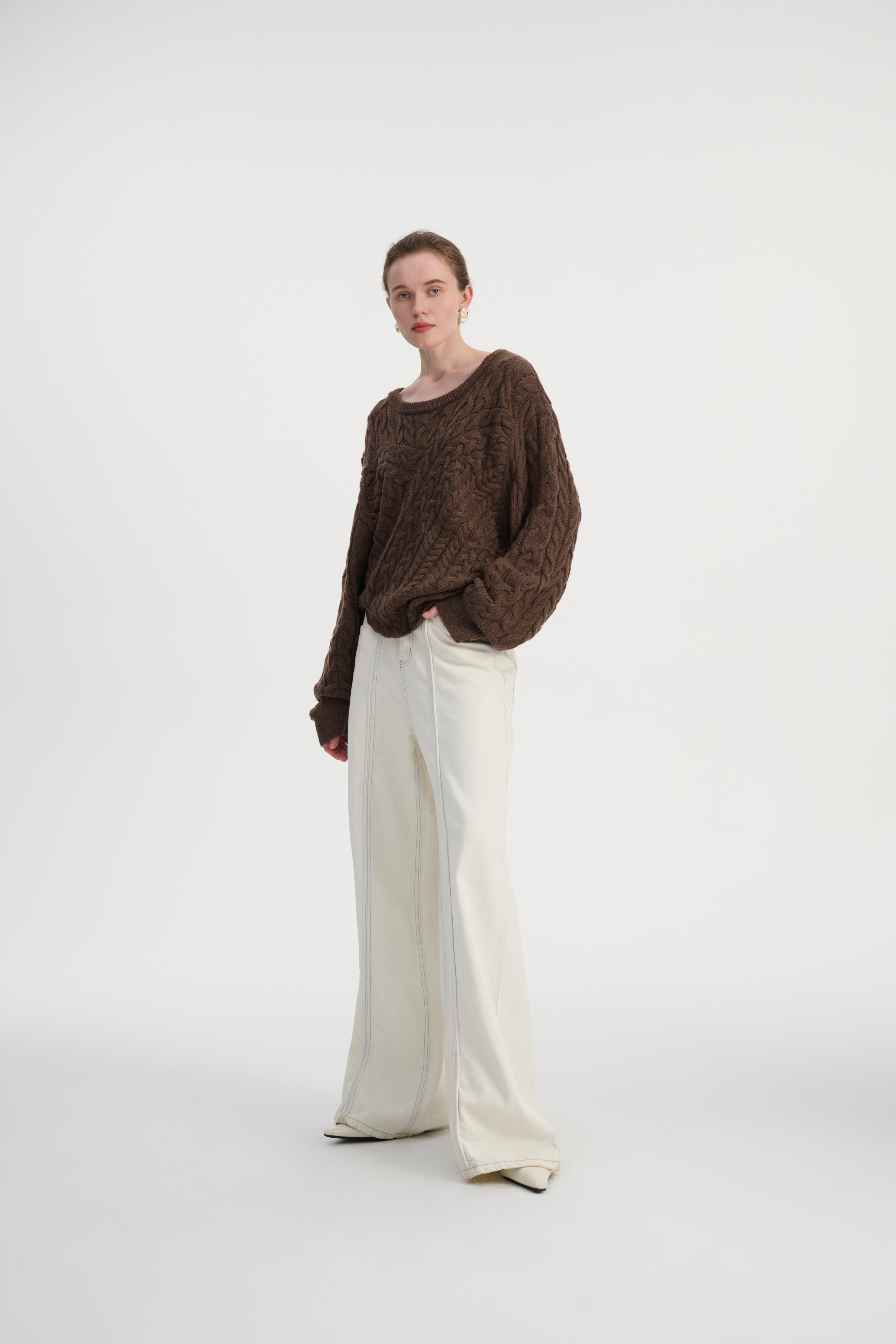 Asymmetrical cable knit sweater