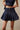 Pleated denim mini skort