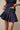 Pleated denim mini skort